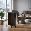 Electric Heater Hire London | 3kW Oil Filled Radiator (Silent Indoor Heating) 20 3kW oil filled radiator with digital temperature display set to 20 degrees in a modern home office