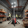Rechargeable Lighting Tower Hire London | Milwaukee MX FUEL 3.1m LED Work Tower (27,000 Lumens) 25 Milwaukee MX FUEL LED lighting tower illuminating an indoor construction site with workers and materials - Lighting Tower Hire London | Powerful Milwaukee MX FUEL 3.1m Work Tower 27,000 Lumens