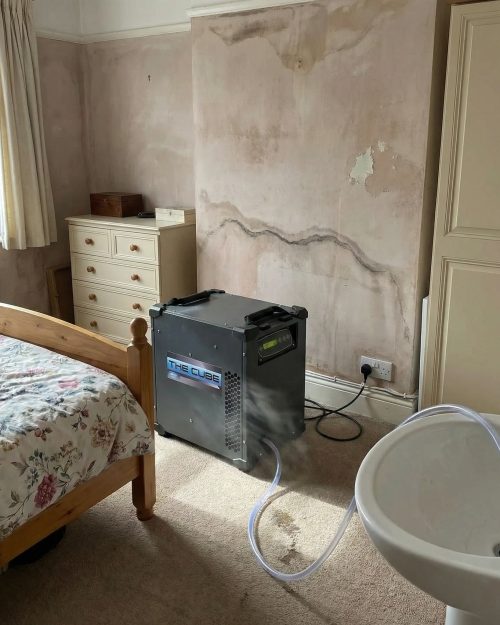Dri-Eaz Cube Dehumidifier Hire London | Compact Professional 43L (F571) 13 Dri-Eaz Cube dehumidifier drying a bedroom after a leak in London