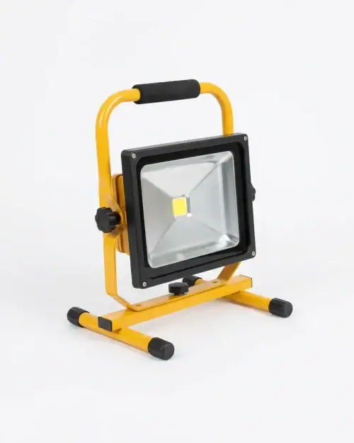 Close-up of 30W LED flood light head with yellow frame and rubber handle for 110V tripod site light