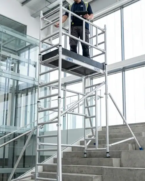 Stairwell scaffold tower hire configured for safe staircase access with adjustable legs