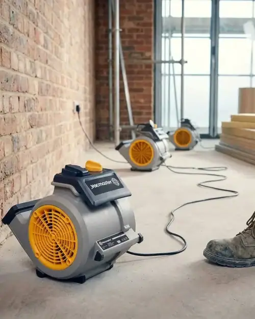 Multiple Vacmaster air movers lined up for site drying setup