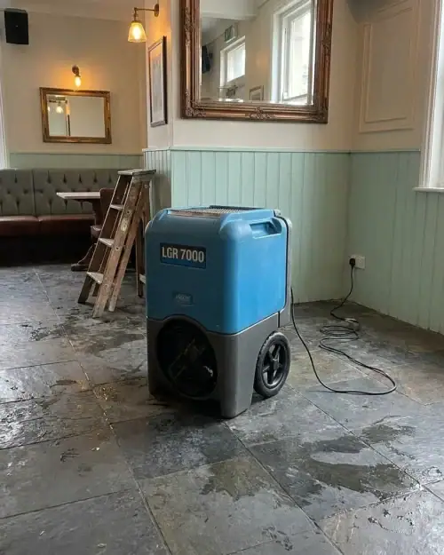 Dehumidifier drying package deployed in a UK pub for flood recovery and humidity control hire London