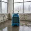 55L Industrial Dehumidifier Hire London | Dri-Eaz DrizAir 1200 (230V) 18 Drieaz 1200 industrial dehumidifier hire London β operative wheeling unit across large commercial space with London skyline