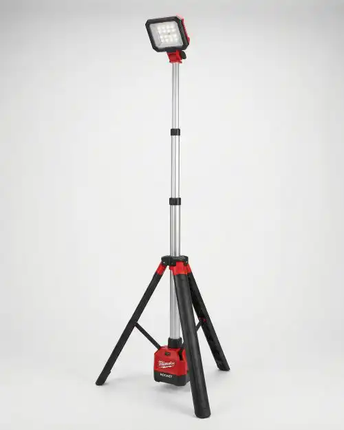 Milwaukee M12 cordless ROCKET stand light fully extended on tripod for site lighting