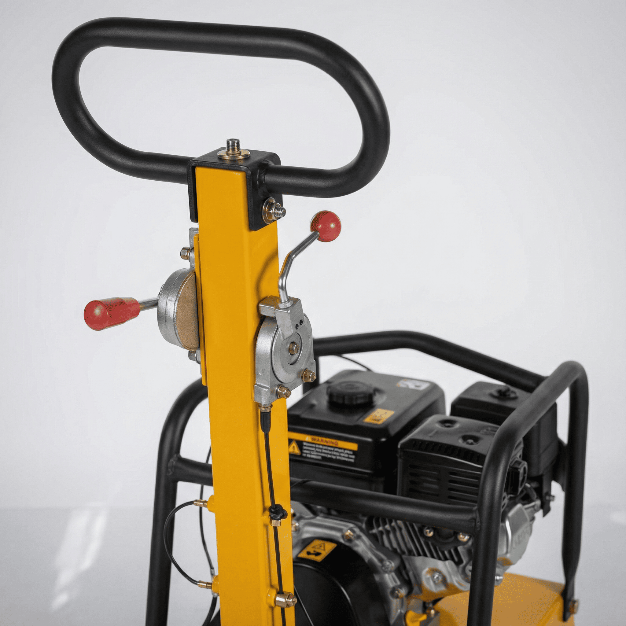 Reversible Plate Compactor Hire London | 18 inch Petrol Wacker Plate (25kN Class) 2 Construction worker using an 18 inch reversible petrol plate compactor on a gravel driveway base