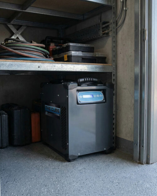 Size comparison showing how compact the Dri-Eaz Cube dehumidifier is