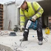 Light Breaker Hire London | DeWalt 110V SDS Max Demolition Hammer 23 Worker in hi-vis using light breaker hire to demolish concrete on outdoor London construction site with Bosch GSH 5 CE