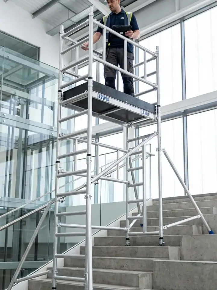 Stairwell Scaffold Tower Hire 1 Stairwell scaffold tower hire configured for safe staircase access with adjustable legs