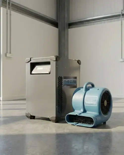 Industrial dehumidifier and air mover package positioned for commercial building drying hire London