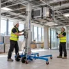 Genie Material Lift Hire London (SLA10–SLA25) – RSJ, Ducting & Plasterboard Lift 25 Genie SLA material lift raising an HVAC unit to ceiling height on a London office fit-out