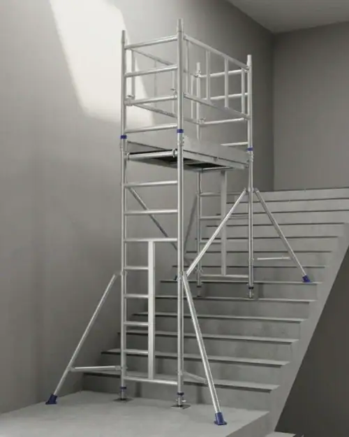Aluminium stairwell scaffold tower set up across a staircase with adjustable legs levelling it on each step